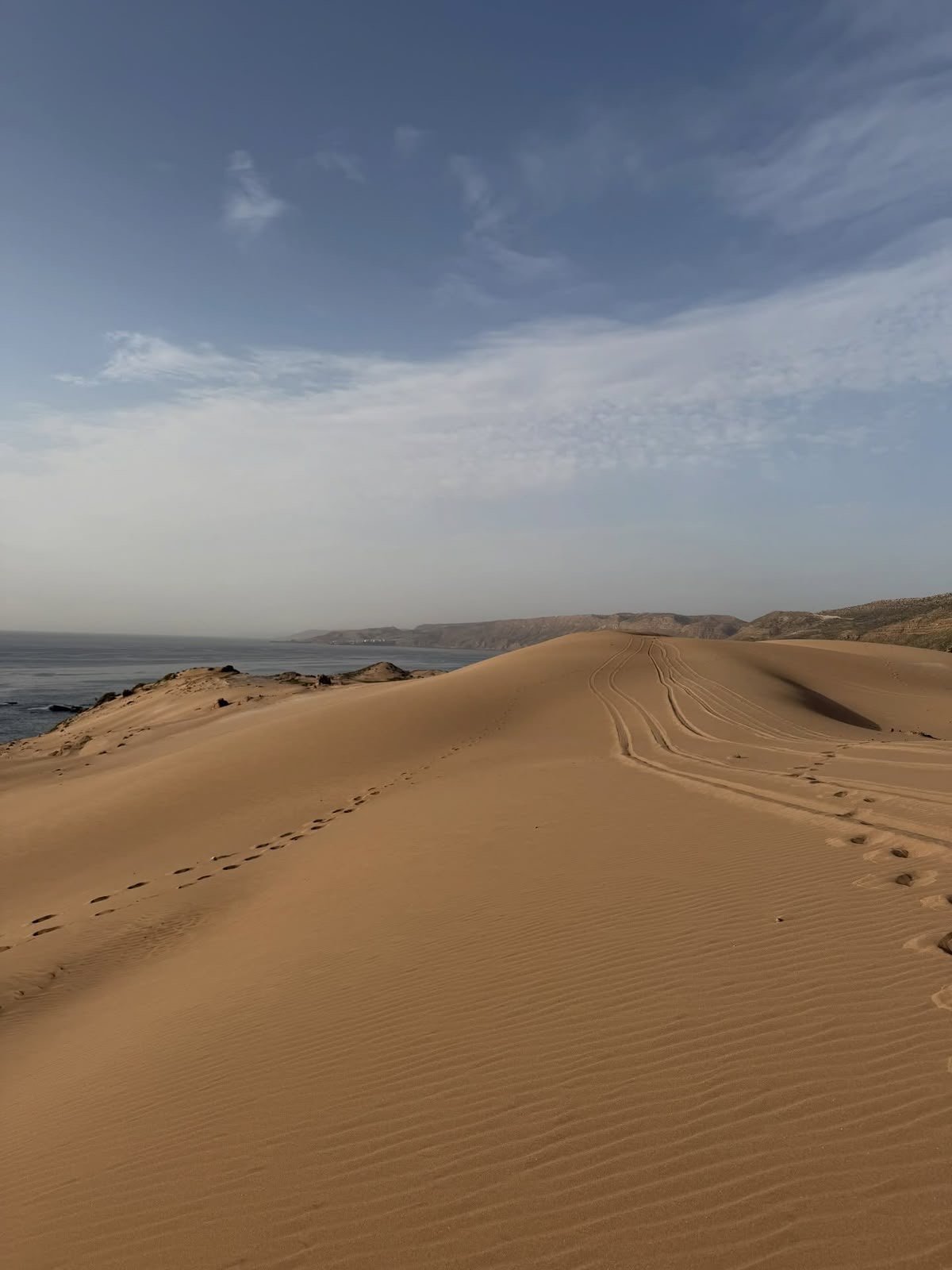 Golden sand dunes next to the Atlantic Ocean